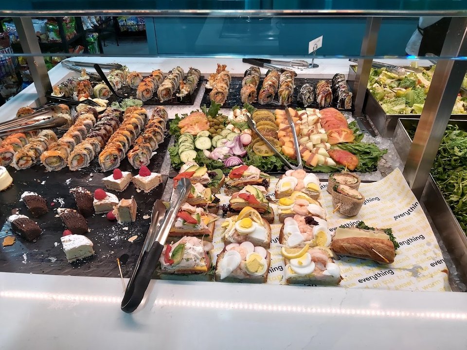 Fast-casual market seating near the counter.